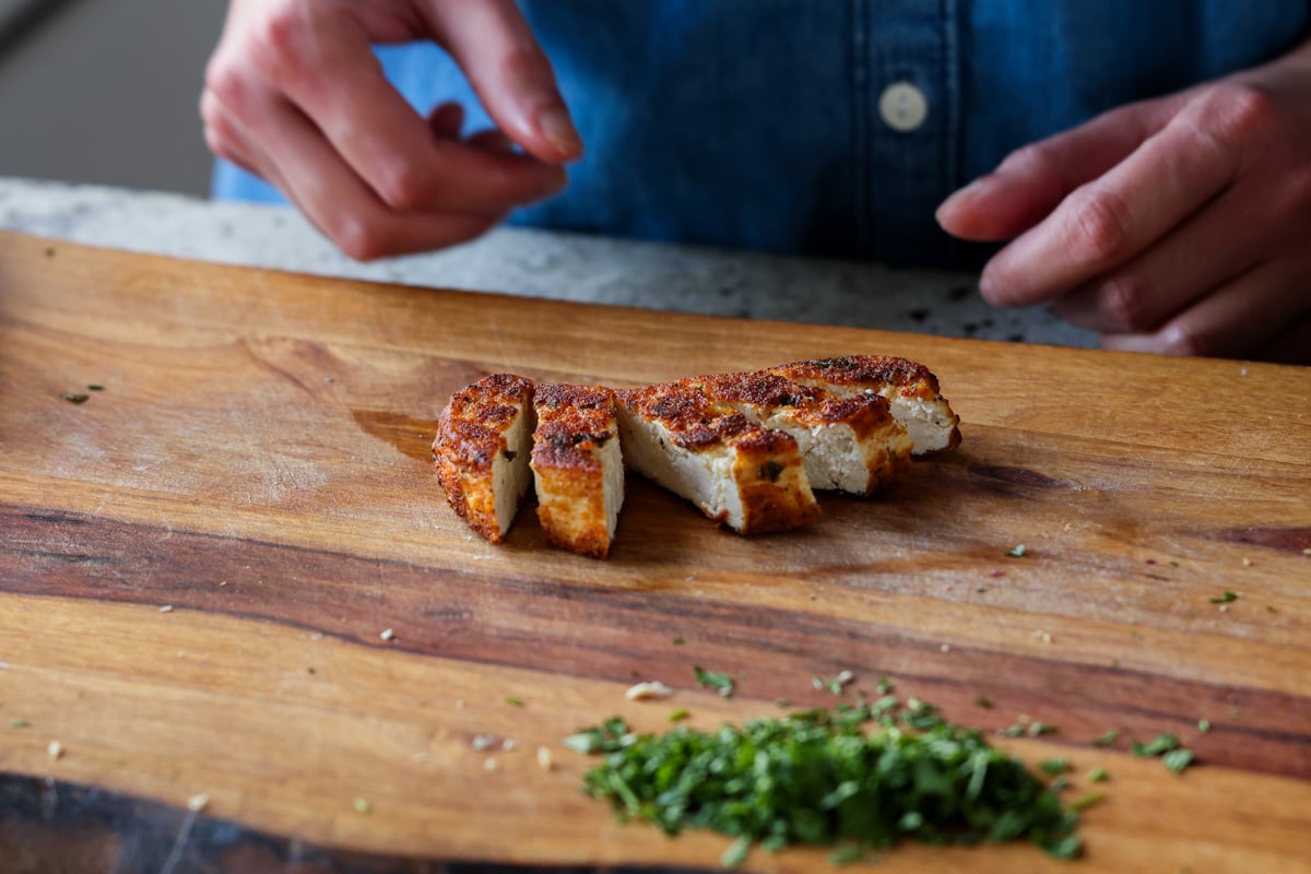 crispy tofu on the cutting board after slicing