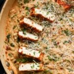 close-up of garlic parmesan orzo in the pan with the crispy tofu