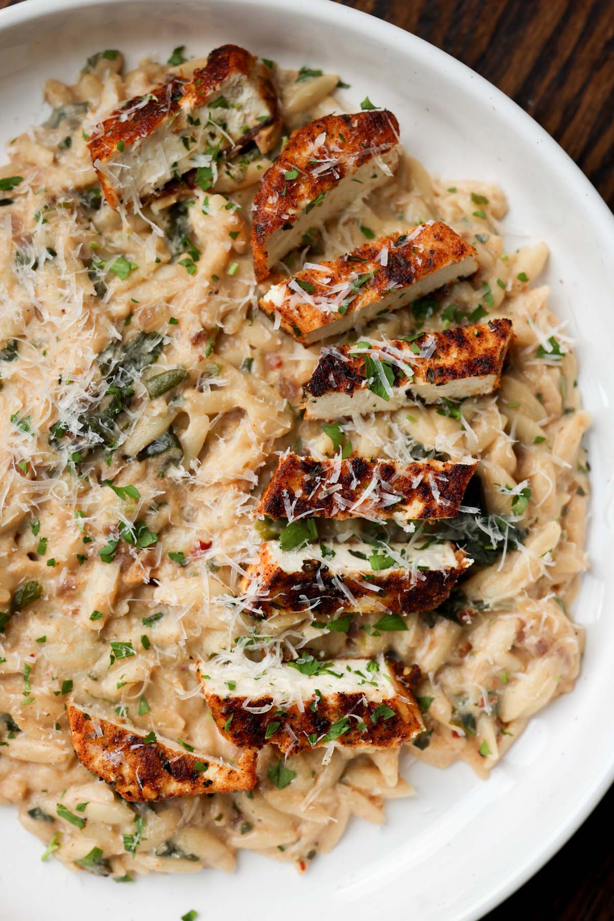 garlic parmesan orzo on a plate with the crispy tofu