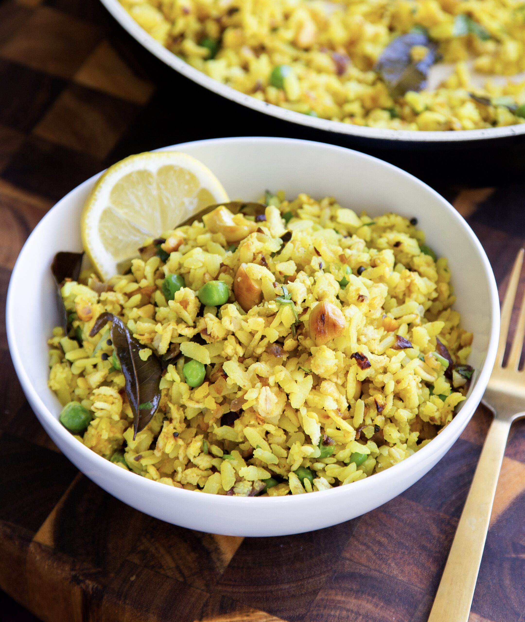 bowl of Indian Poha with peas and spices