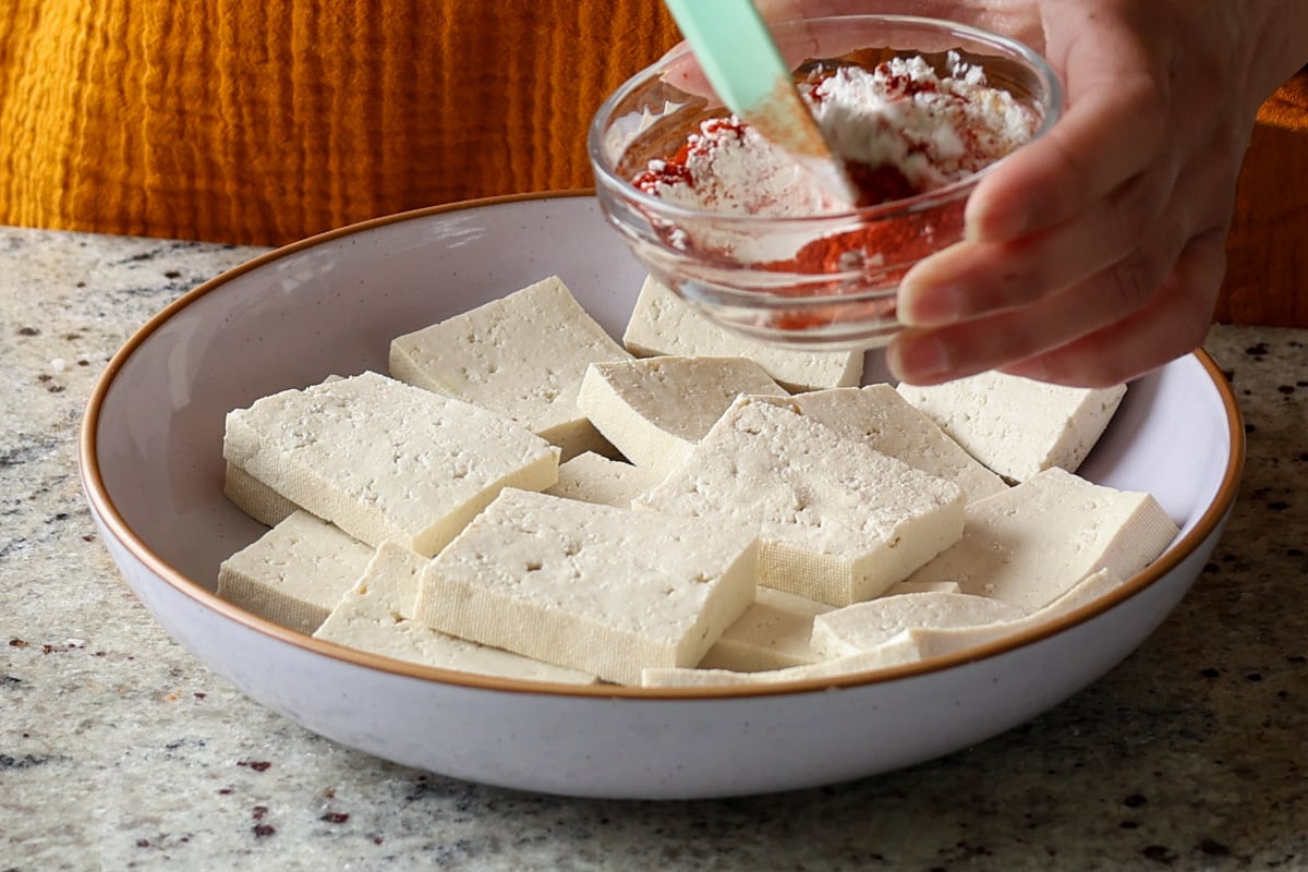 mixing the cornstarch and spices for the tofu