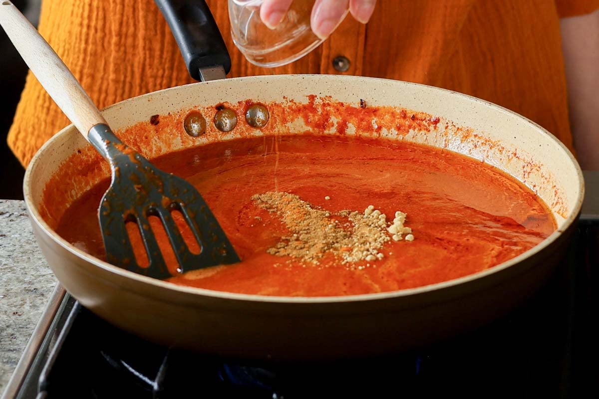 adding ground spices to the pan