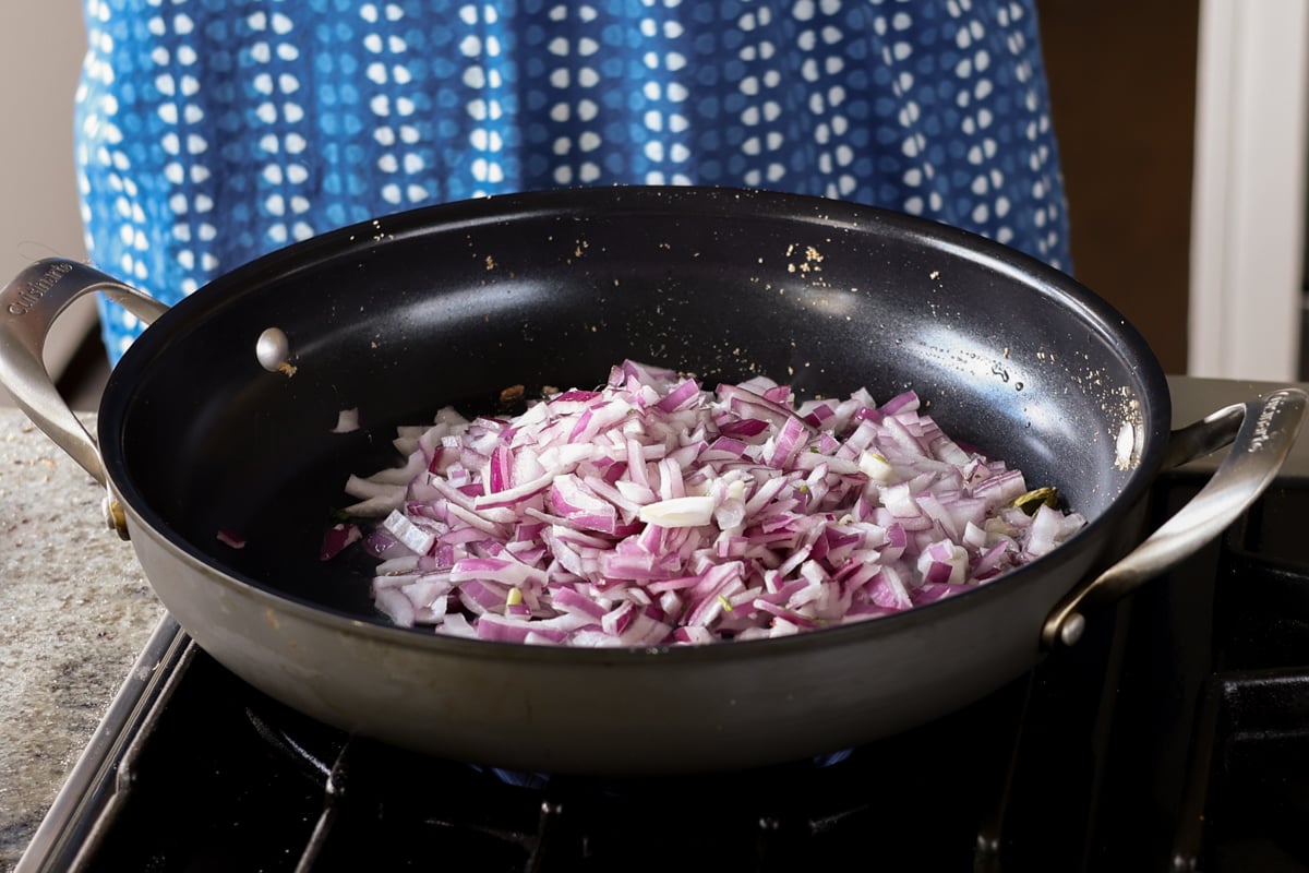 adding onion to the pan