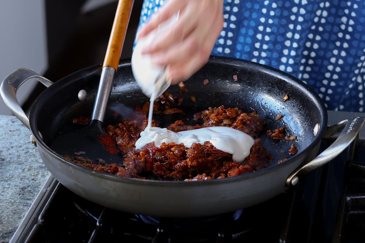 adding non-dairy yogurt to the pan