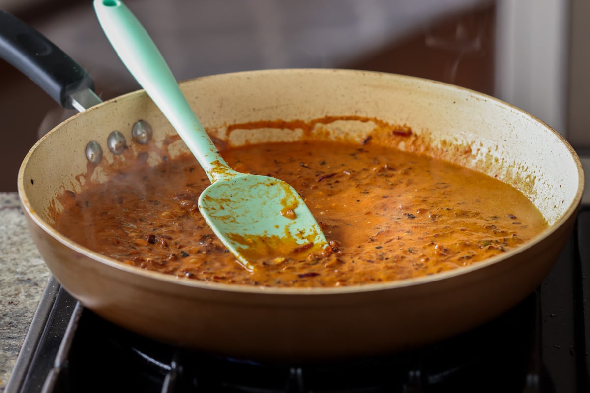 simmering the sauce for the paneer ghee roast