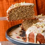serving a slice of pistachio cake