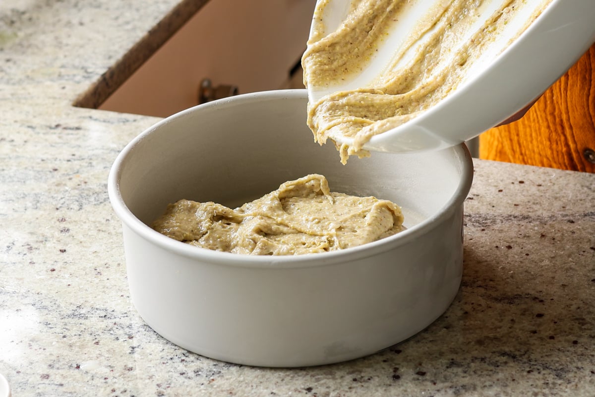 pouring the batter into a cake pan