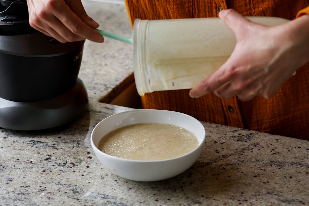 adding pistachio cream to the bowl