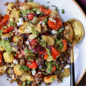 sheet pan gnocchi in a bowl with a spoon