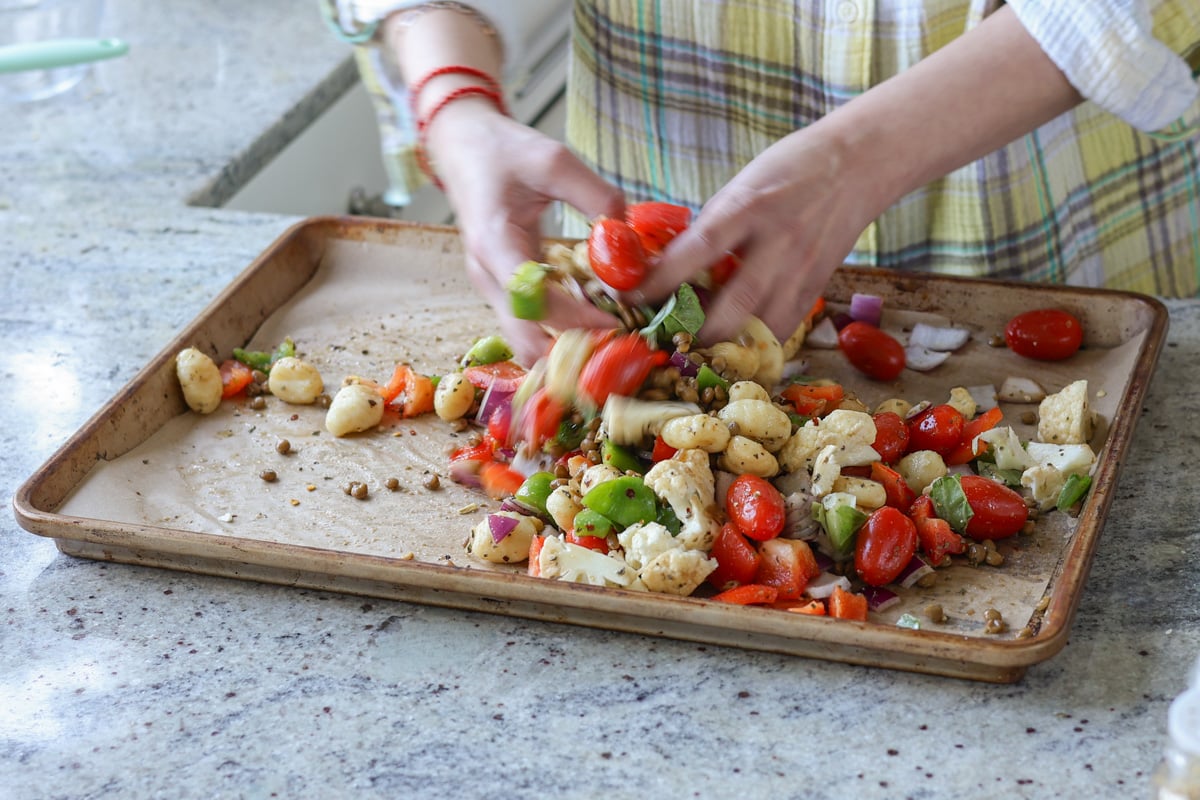 spreading out the gnocchi mixture on the baking sheet