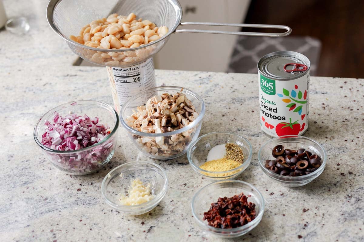 puttanesca beans ingredients on the kitchen counter