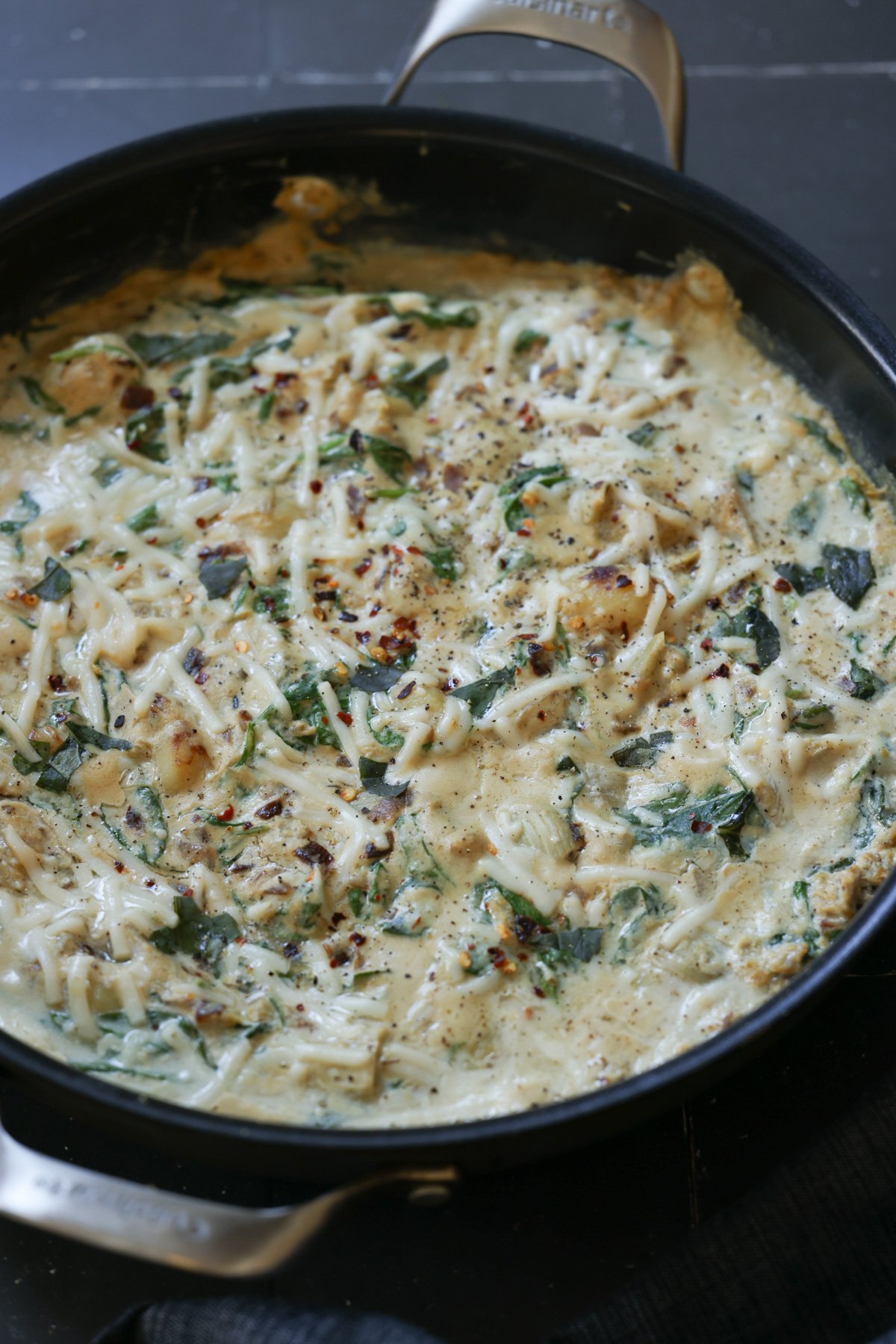 spinach artichoke gnocchi in the pan