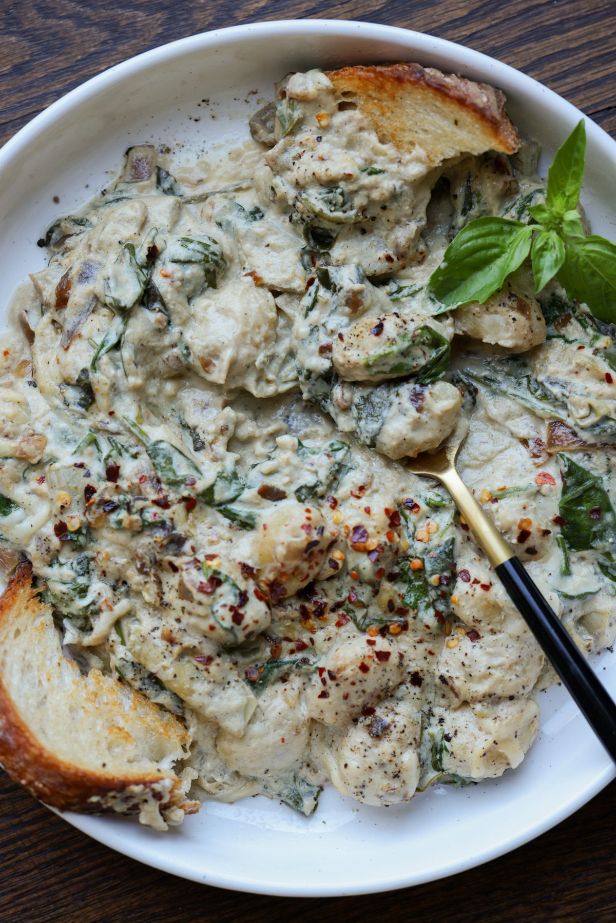bowl of spinach artichoke gnocchi