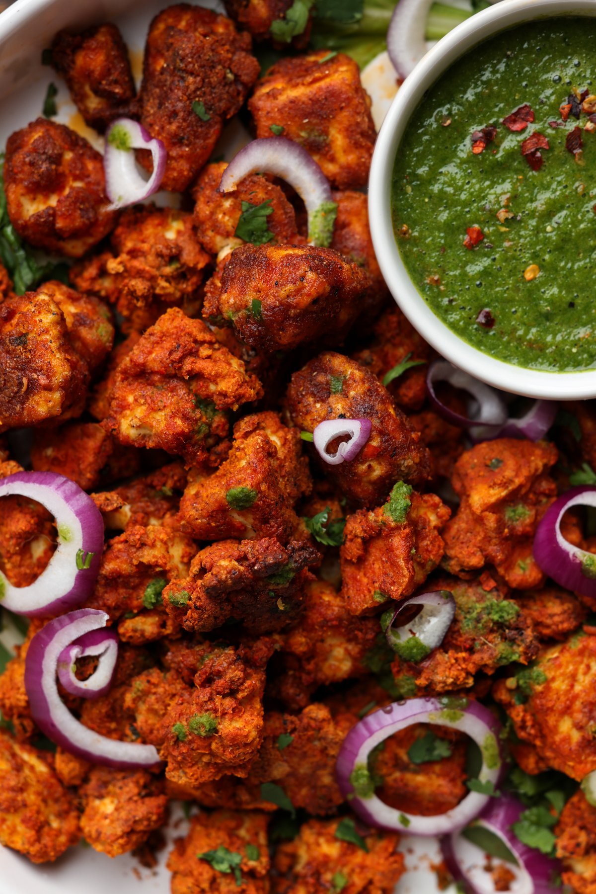 close-up tofu Koliwada with mint chutney on the side