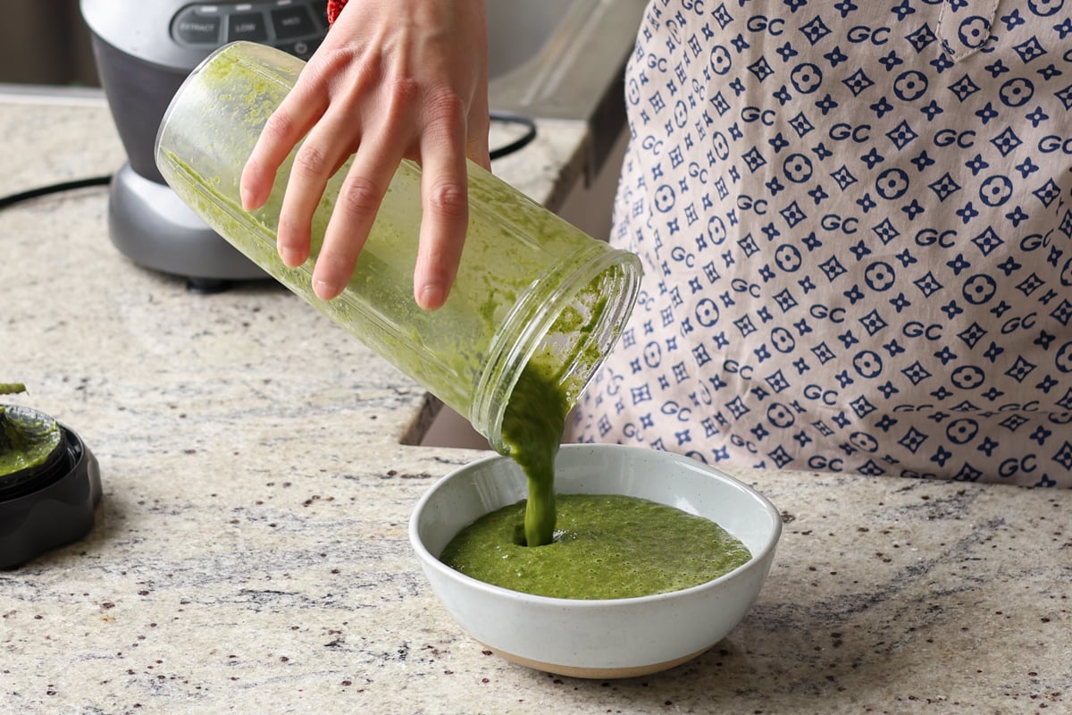 pouring the mint chutney into a serving dish