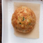 jalapeno popper cheese ball in the baking pan after baking