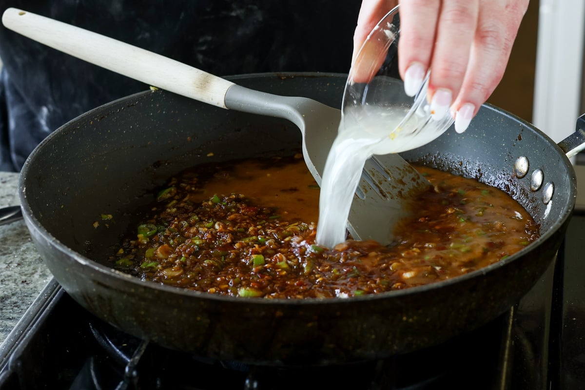 adding cornstarch slurry to the pan