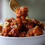 fork taking a bite of Indo-Chinese garlic pepper tofu