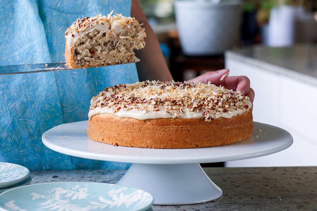 serving a slice of Italian wedding cake