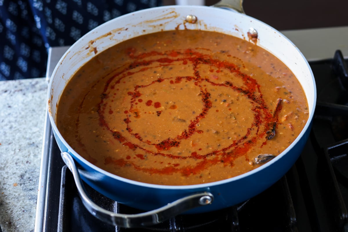 dal makhani in the pan after drizzling the tadka