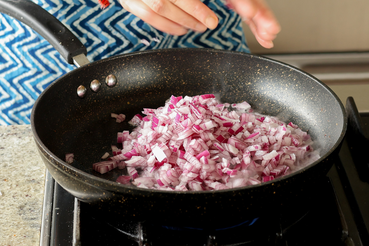 adding onion to the pan