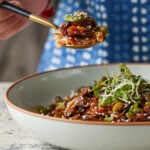 spoon taking a bite of crispy edamame bowl