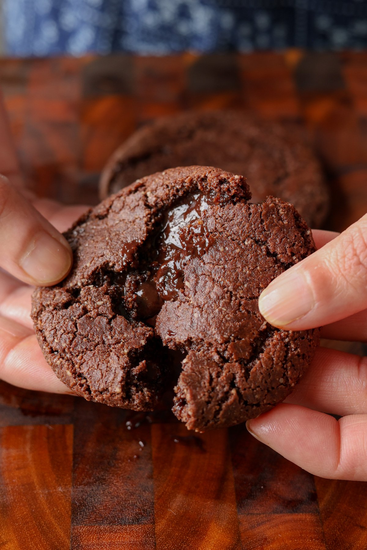 breaking open a lava cookie so you can see the inside