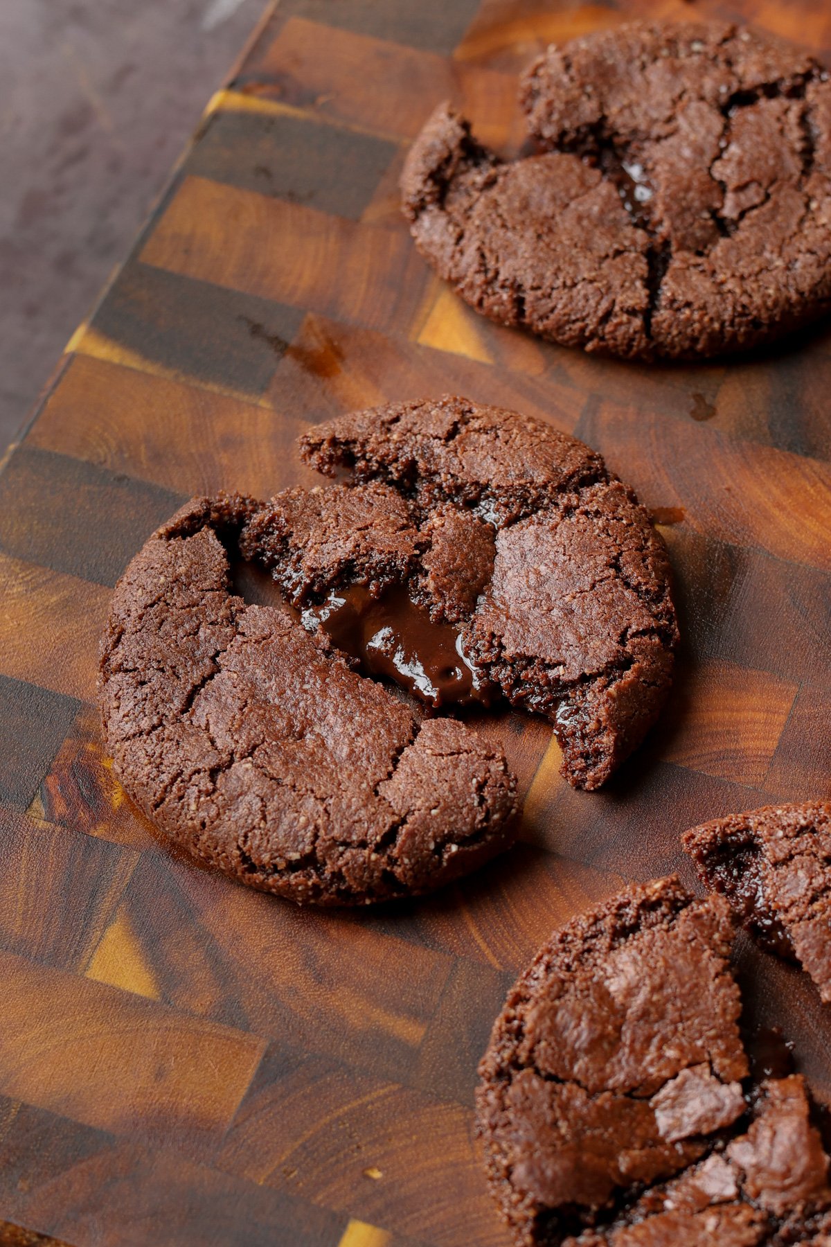 close-up of a broken open lava cookie on the cutting board