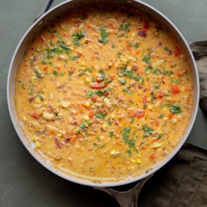 lemon white bean soup in the pan with garnishes
