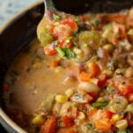 spoon taking a bite of lemon white bean soup