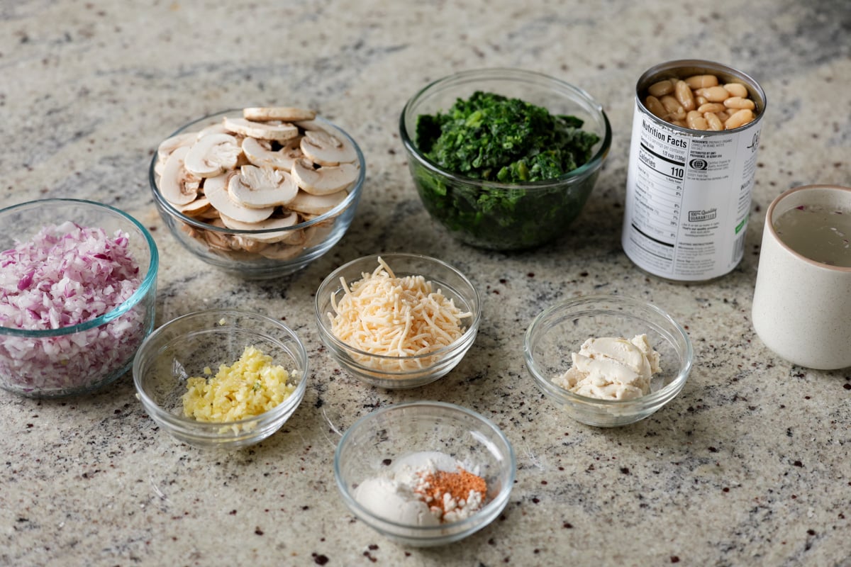 spinach mushroom beans ingredients on the kitchen counter