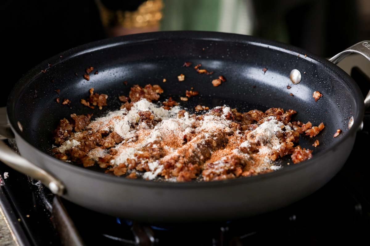 adding flour to the pan