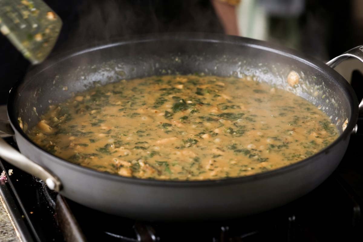 spinach mushroom beans in the pan before cooking