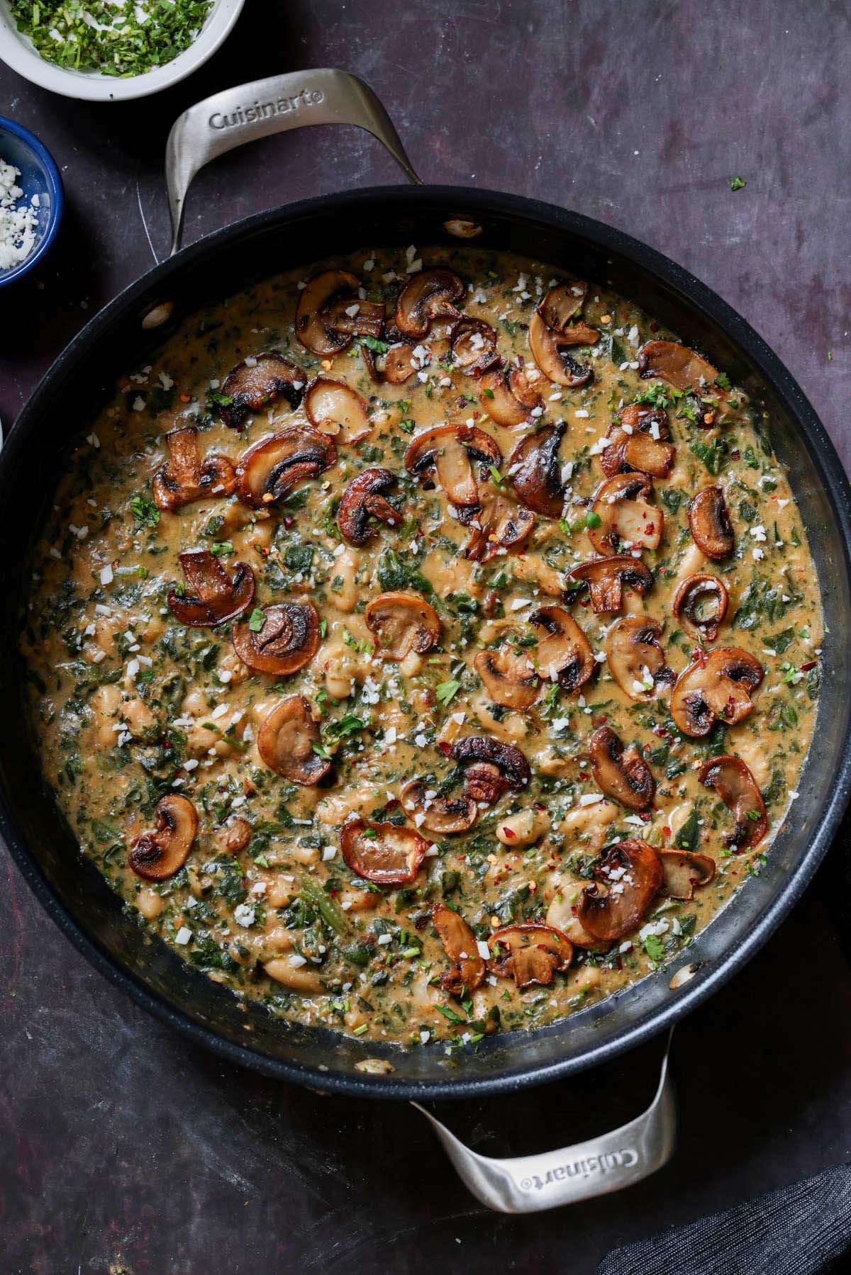 spinach mushroom beans in the pan with garnish