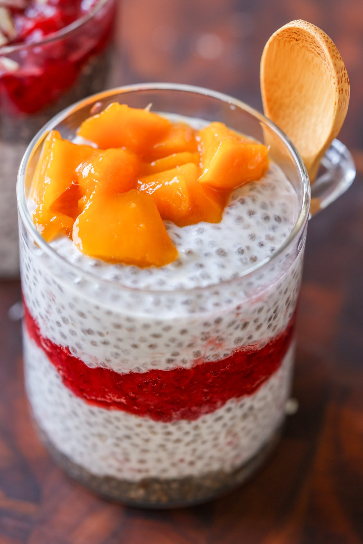 strawberry chia pudding topped with fresh mango