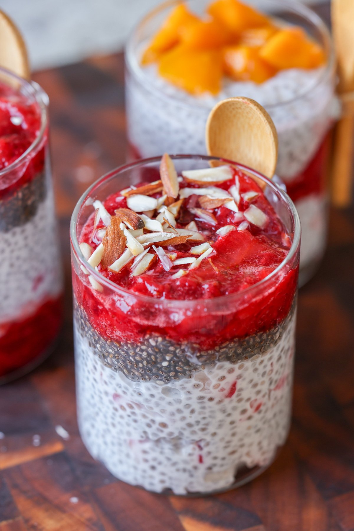 strawberry chia pudding topped with strawberry compote and slivered almonds