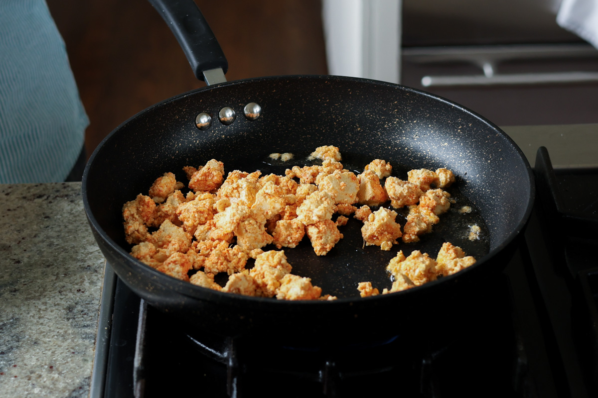 tofu in the frying pan before cooking