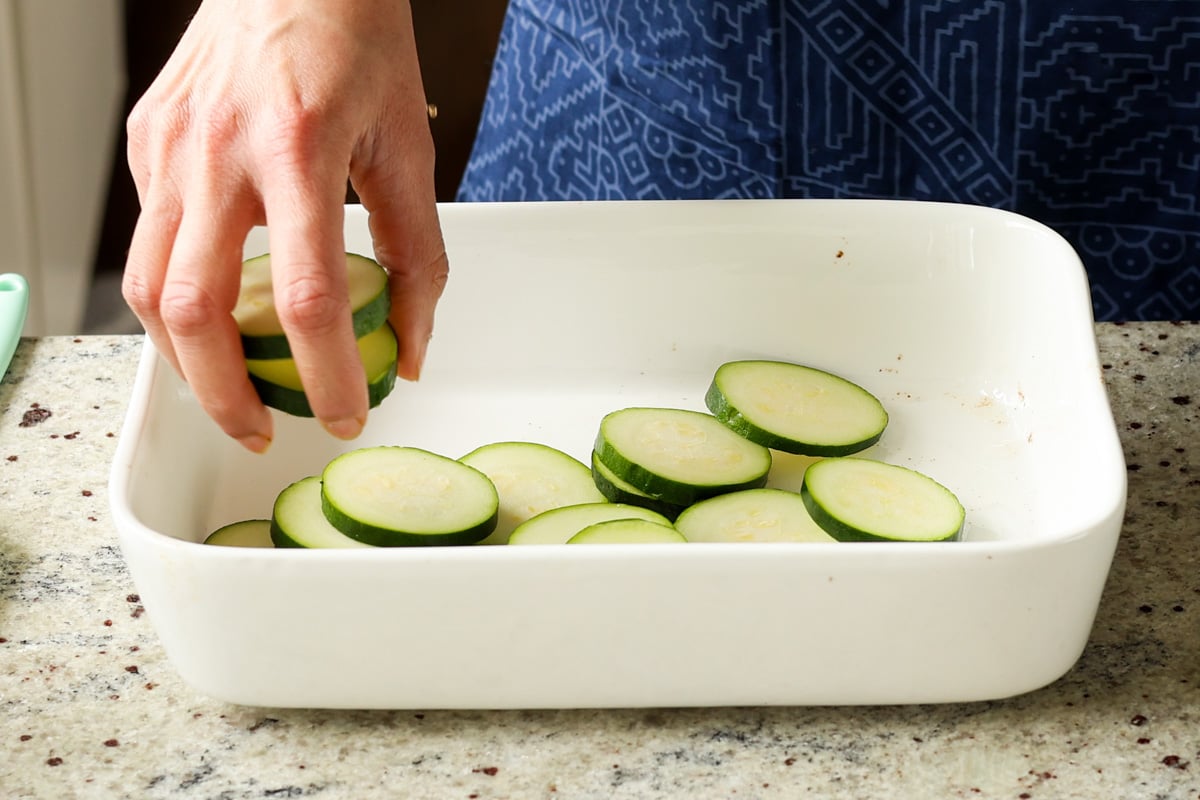 adding zucchini to the pan
