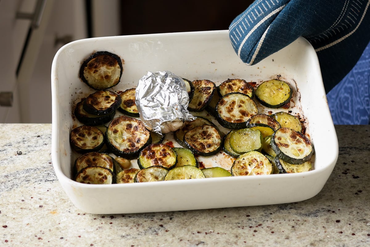 zucchini and garlic in the pan after roasting
