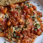skillet gnocchi in a bowl with garlic bread