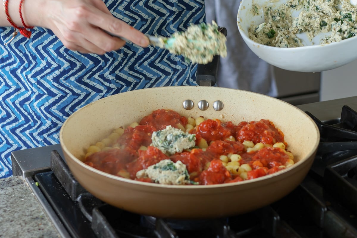 adding ricotta to the pan