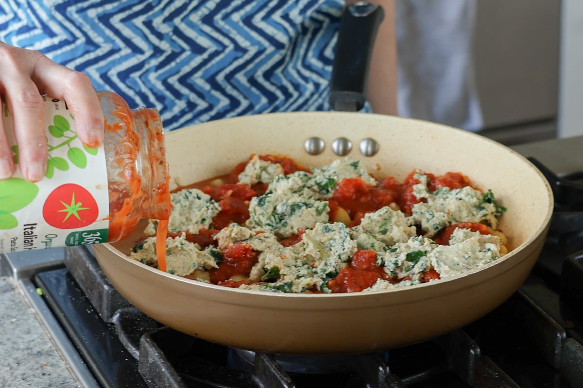 adding water to the pan