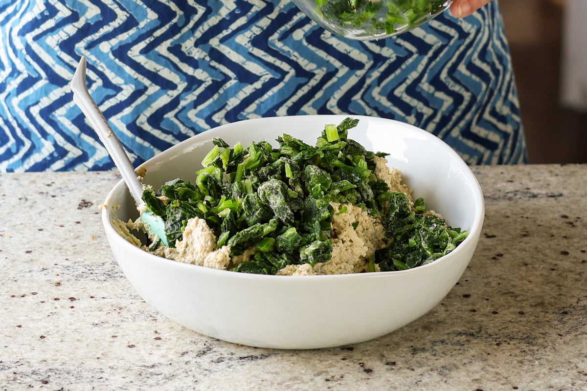 adding spinach to the tofu mixture