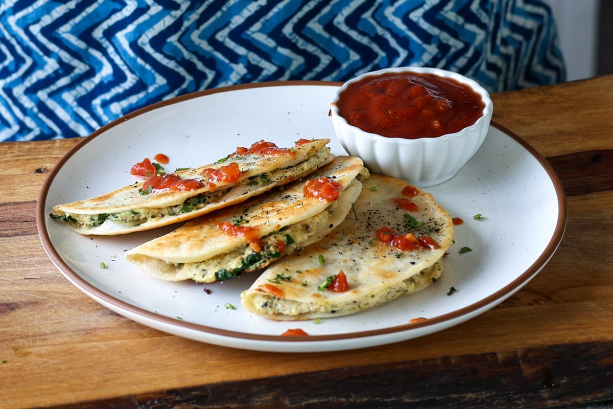 ricotta tacos on a plate with marinara to dip