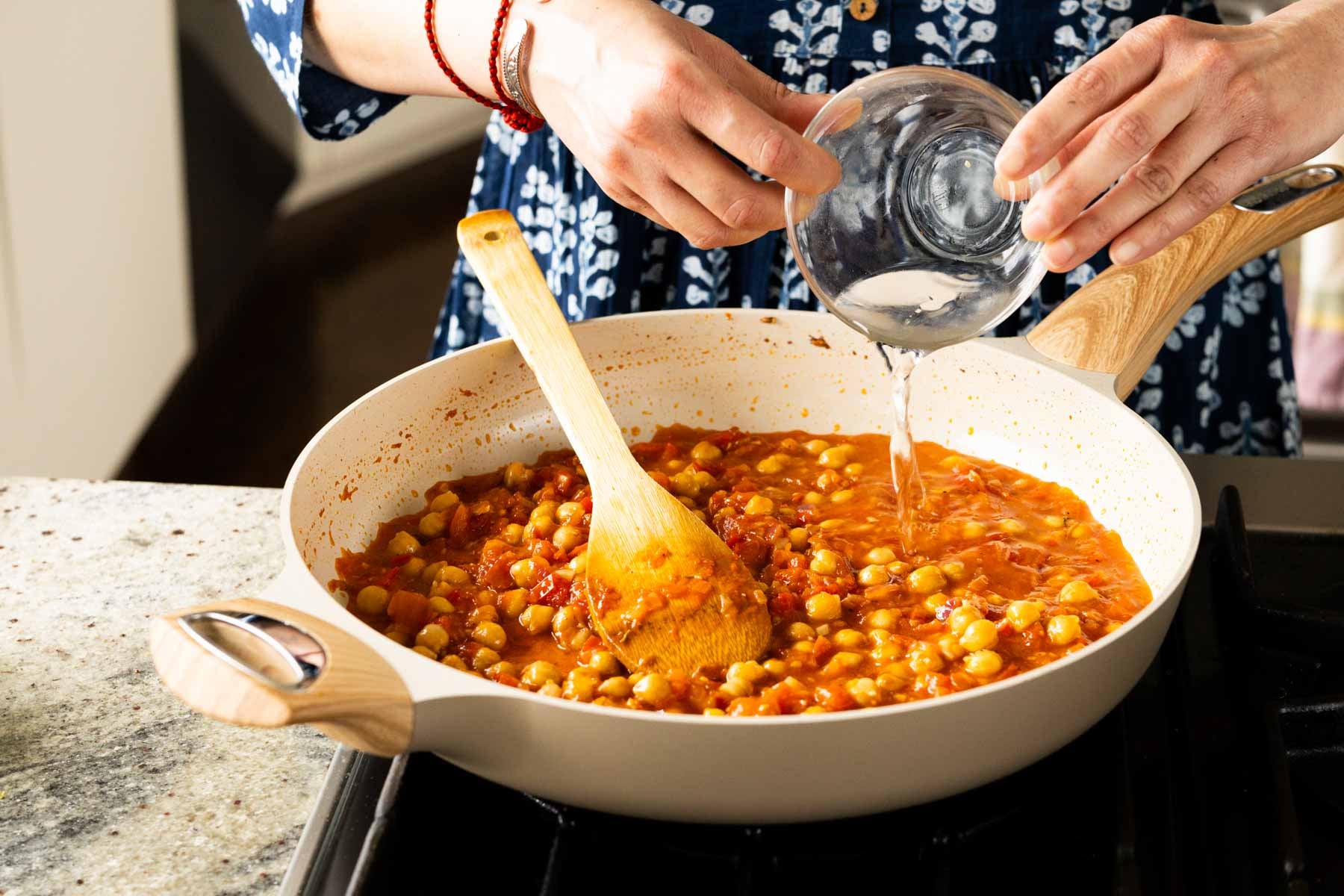 adding water to the pan