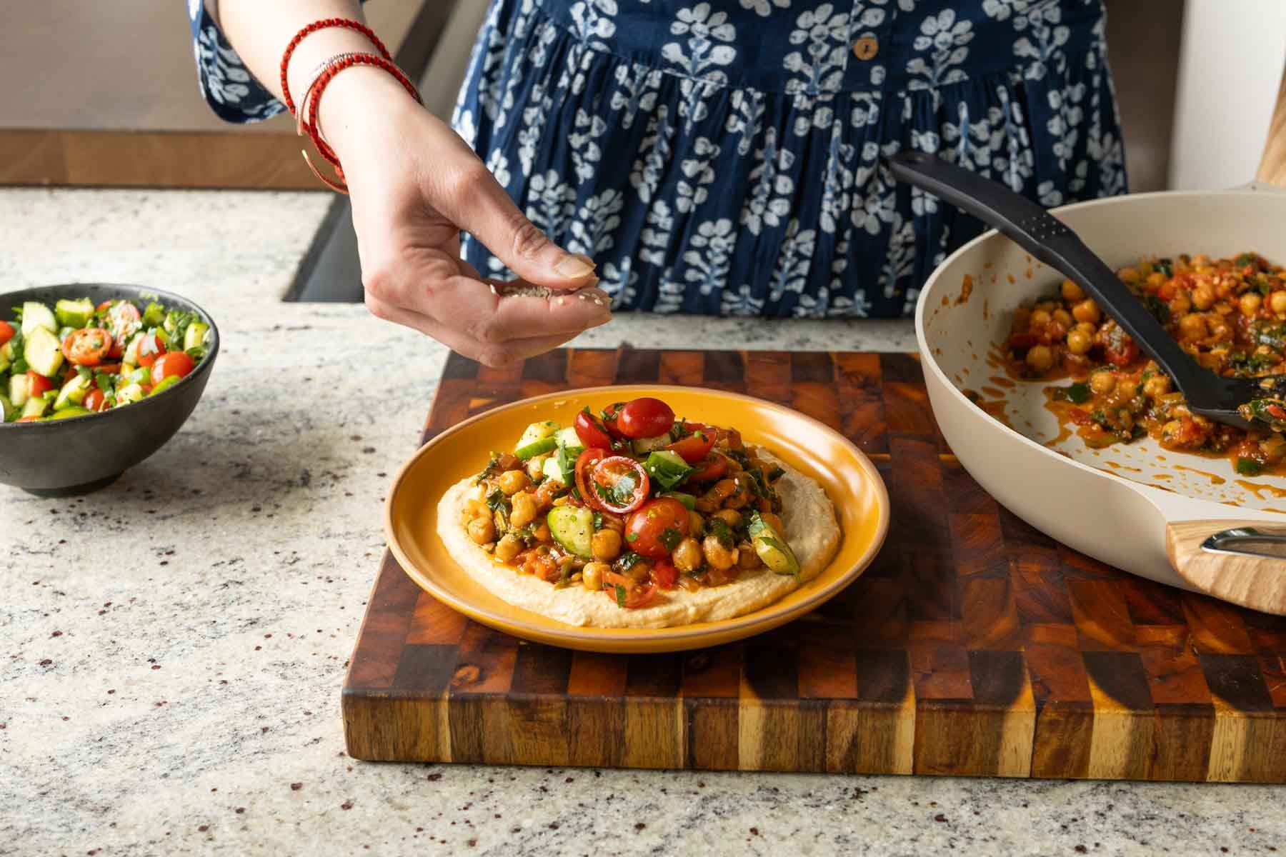 making a dip platter with the peri-peri chickpeas and hummus