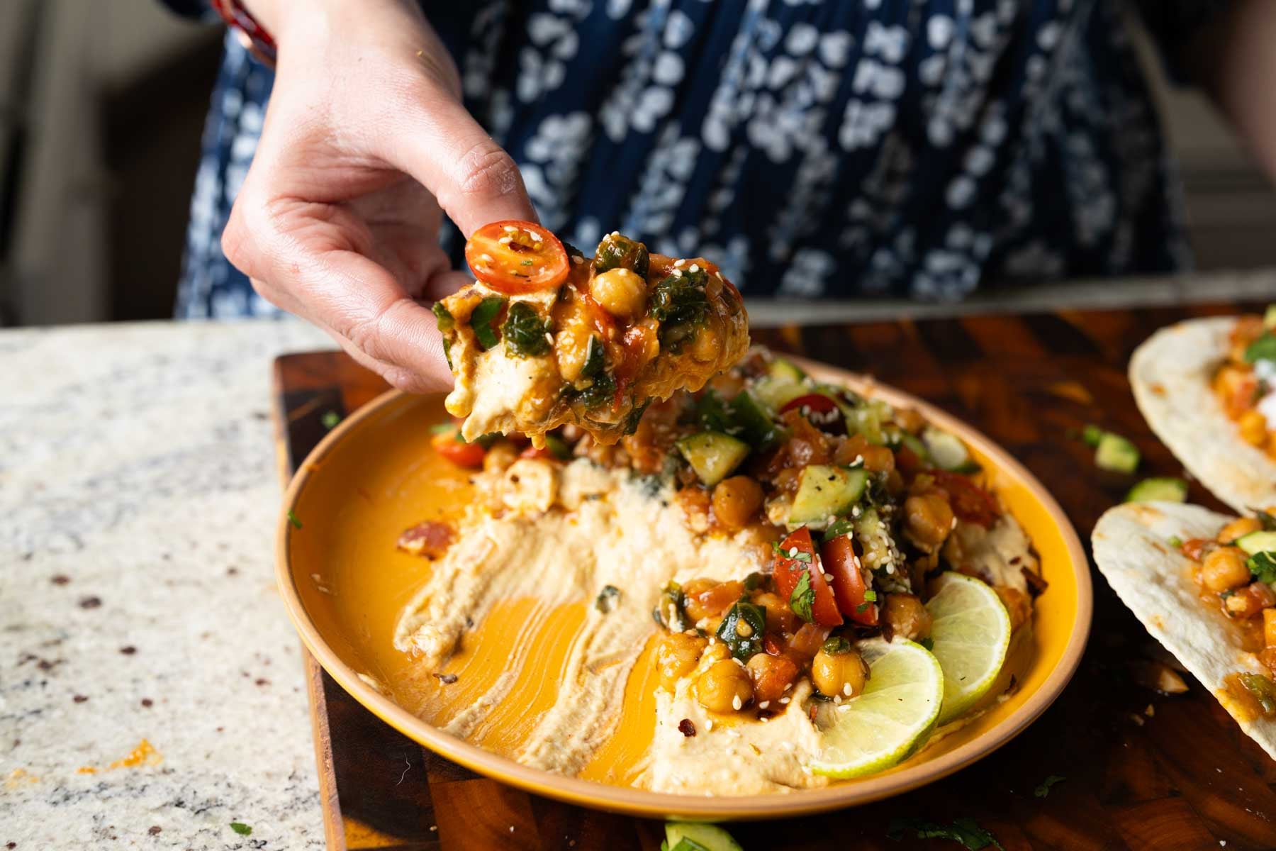 scooping up some of the peri-peri chickpeas from the dip platter