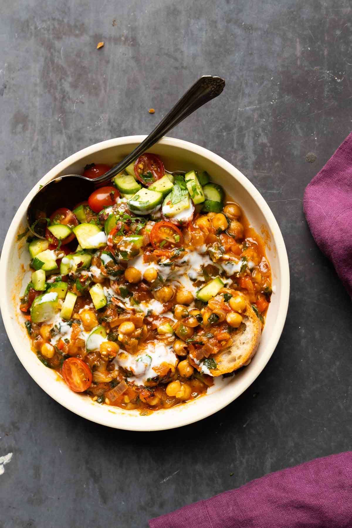bowl of peri-peri chickpeas topped with the salsa and other garnishes