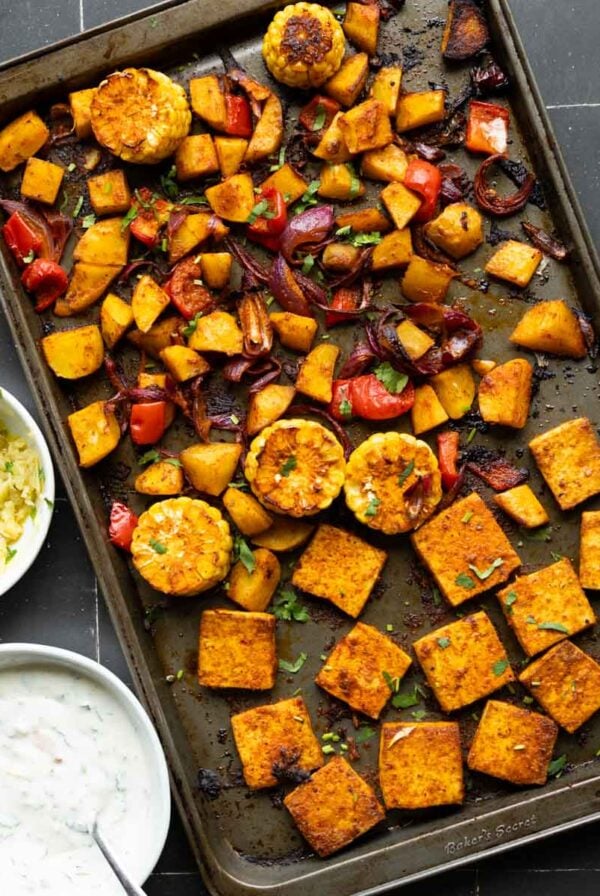 peri-peri tofu and vegetables on the sheet pan after baking