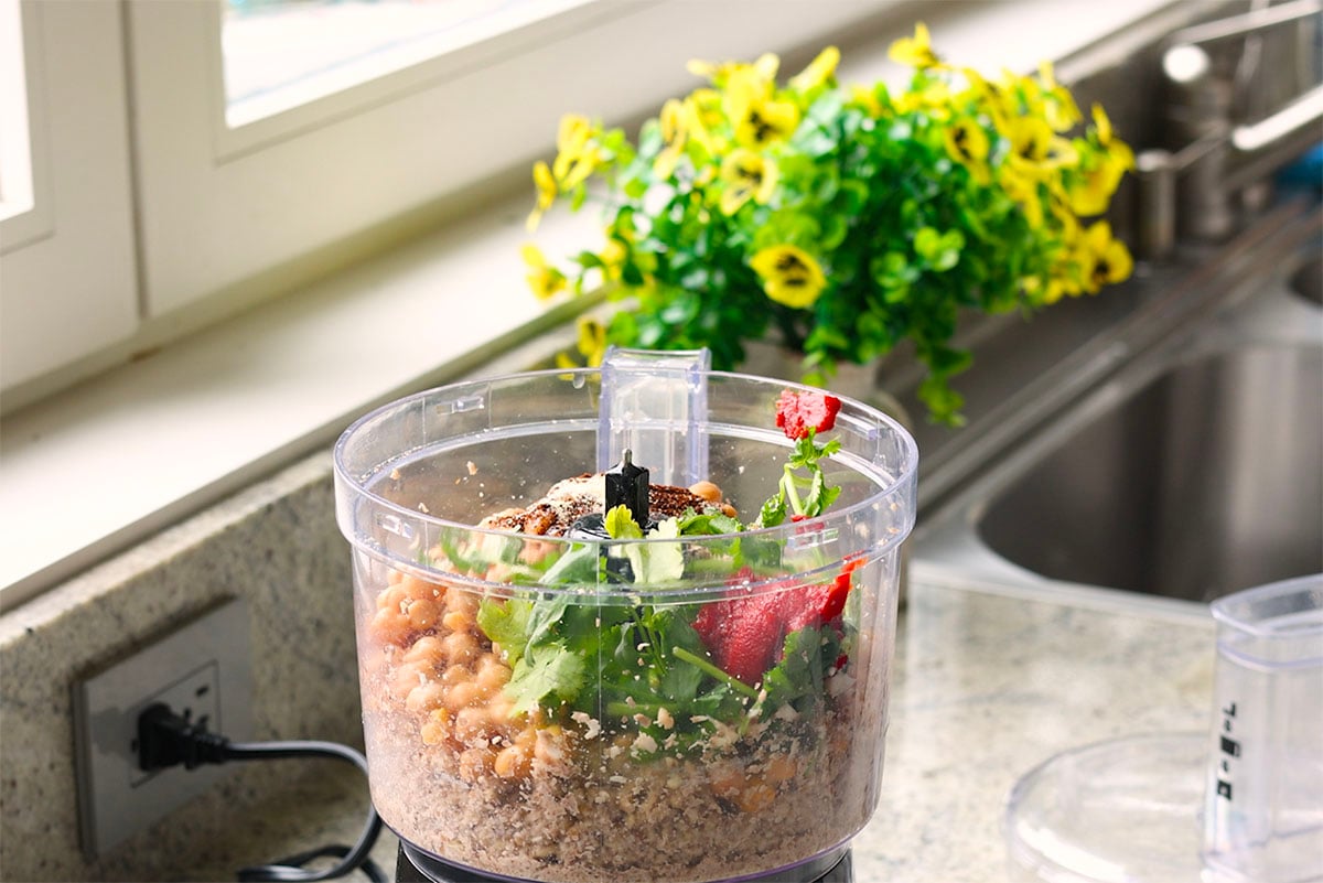 adding rest of ingredients to the food processor